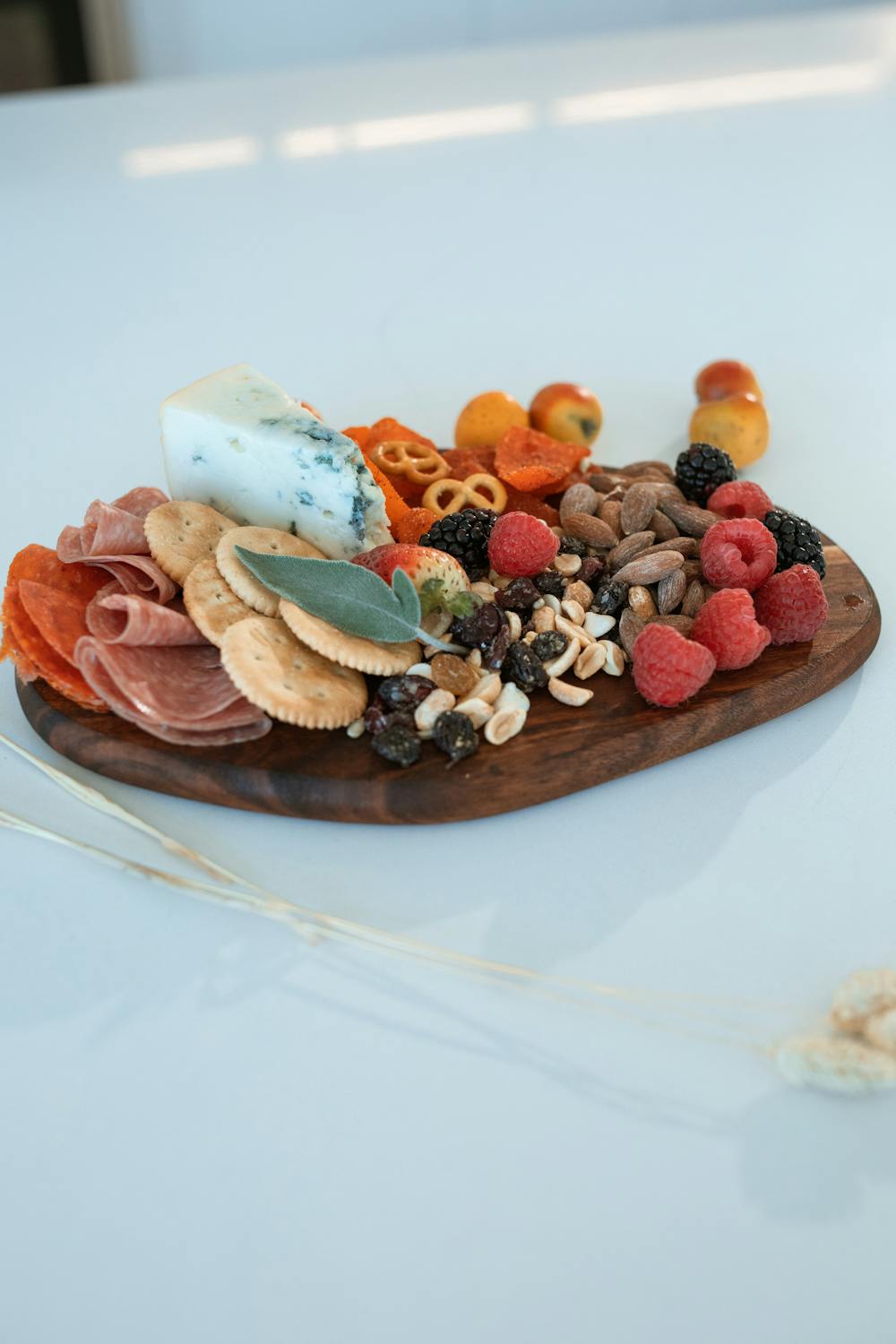 Hand-finished wood serving board with charcuterie