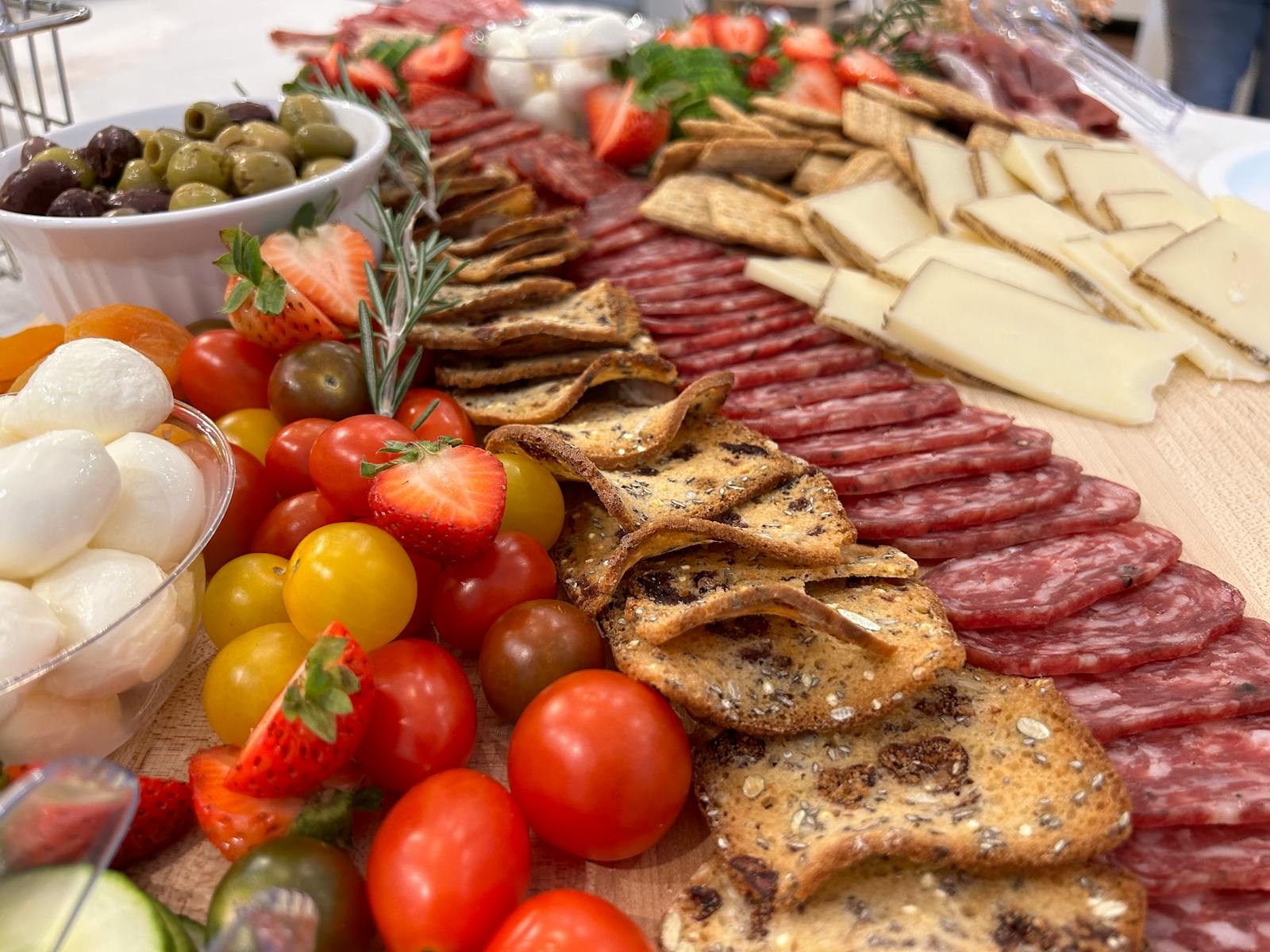 Lush Adam's Apple grazing board with cured meats, cheeses and fresh fruit